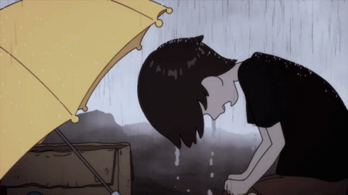 This anime character boy is crying in the middle of the rain