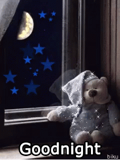 Cute teddy bear sitting on the windowsill with shining pajamas 