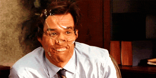 Jim Carrey's face is wrapped up with transparent duct tape and says HELLO