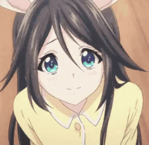 A giggling anime girl with bunny ears