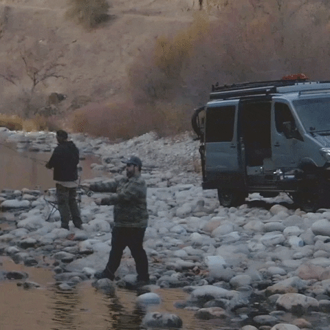 Two fly fishing anglers doing a fly cast