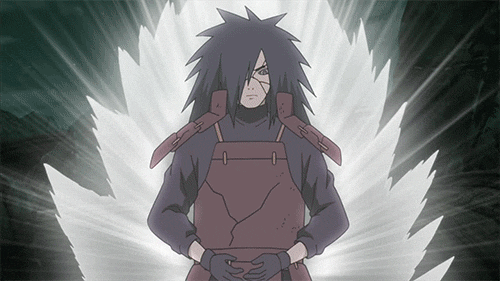 Madara doing hand signs to a summoning technique