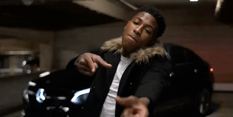 Youngboy Nba raps while giving a gun sign at the camera