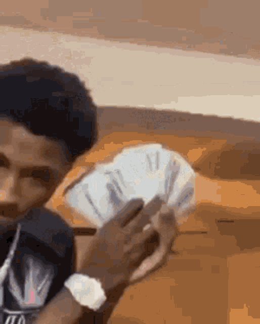 Youngboy Nba showing a huge amount of cash money on the camera