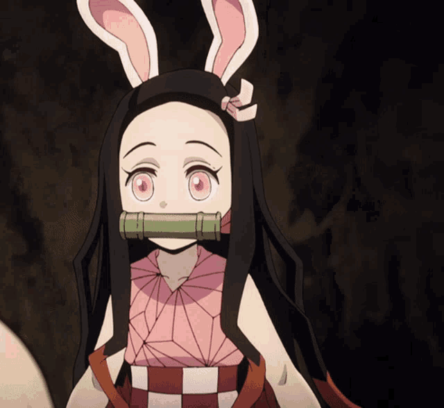 A little Nezuko walks while wearing bunny ears