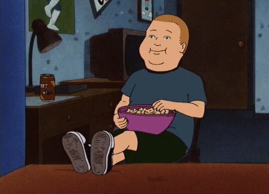 A cartoon character from King of the Hill called Bobby eats popcorn