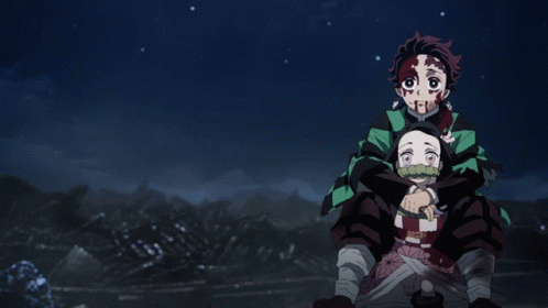 Tanjiro being carried by Nezuko on her back