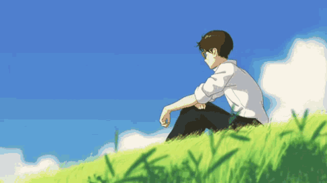 An anime boy sitting on a grass field