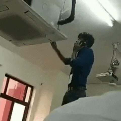 This man seems to be mad while repairing the air-condition